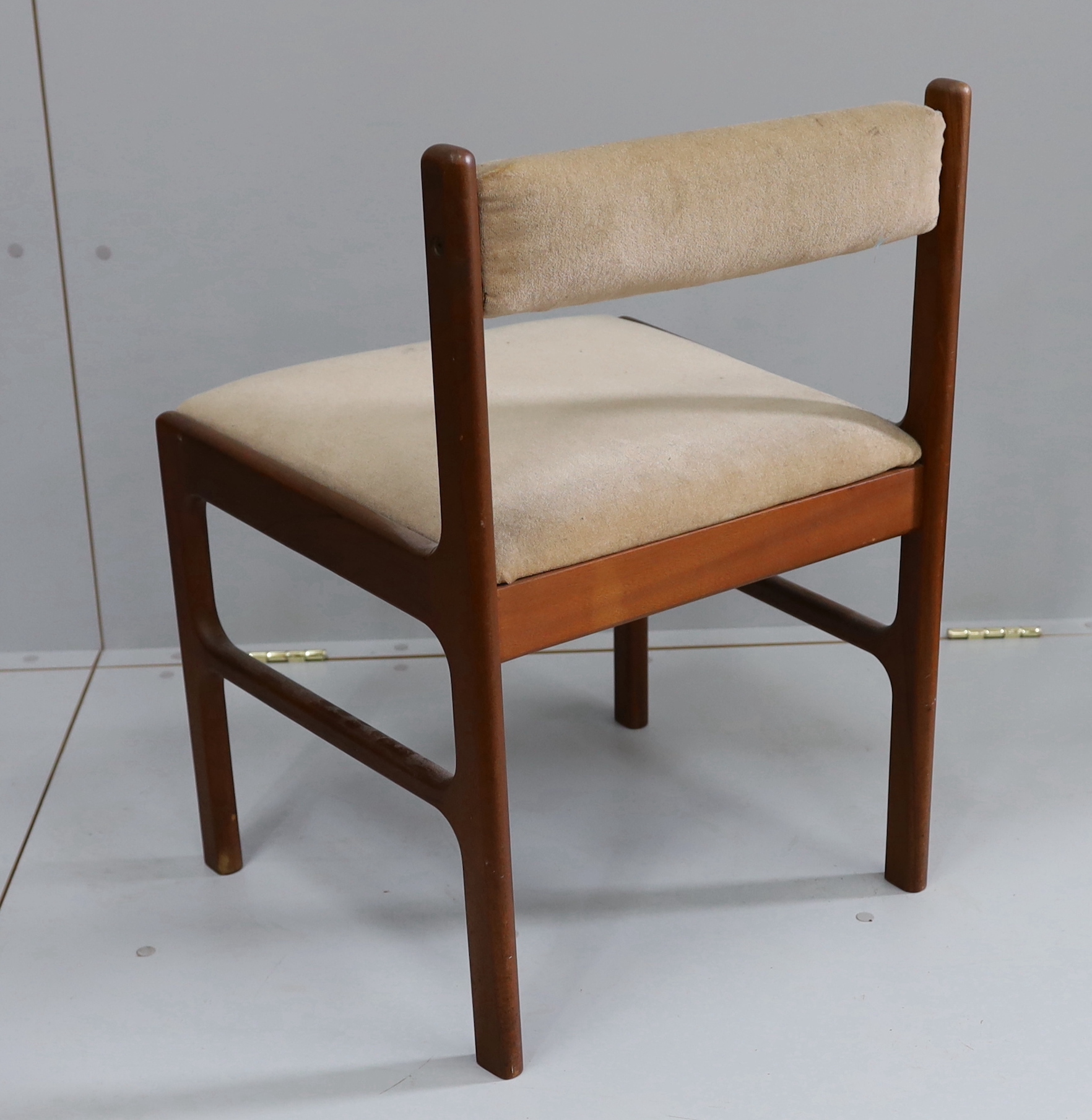 A mid century McInstosh teak draw leaf dining table, 150cm extended, depth 76cm, height 77cm and four chairs